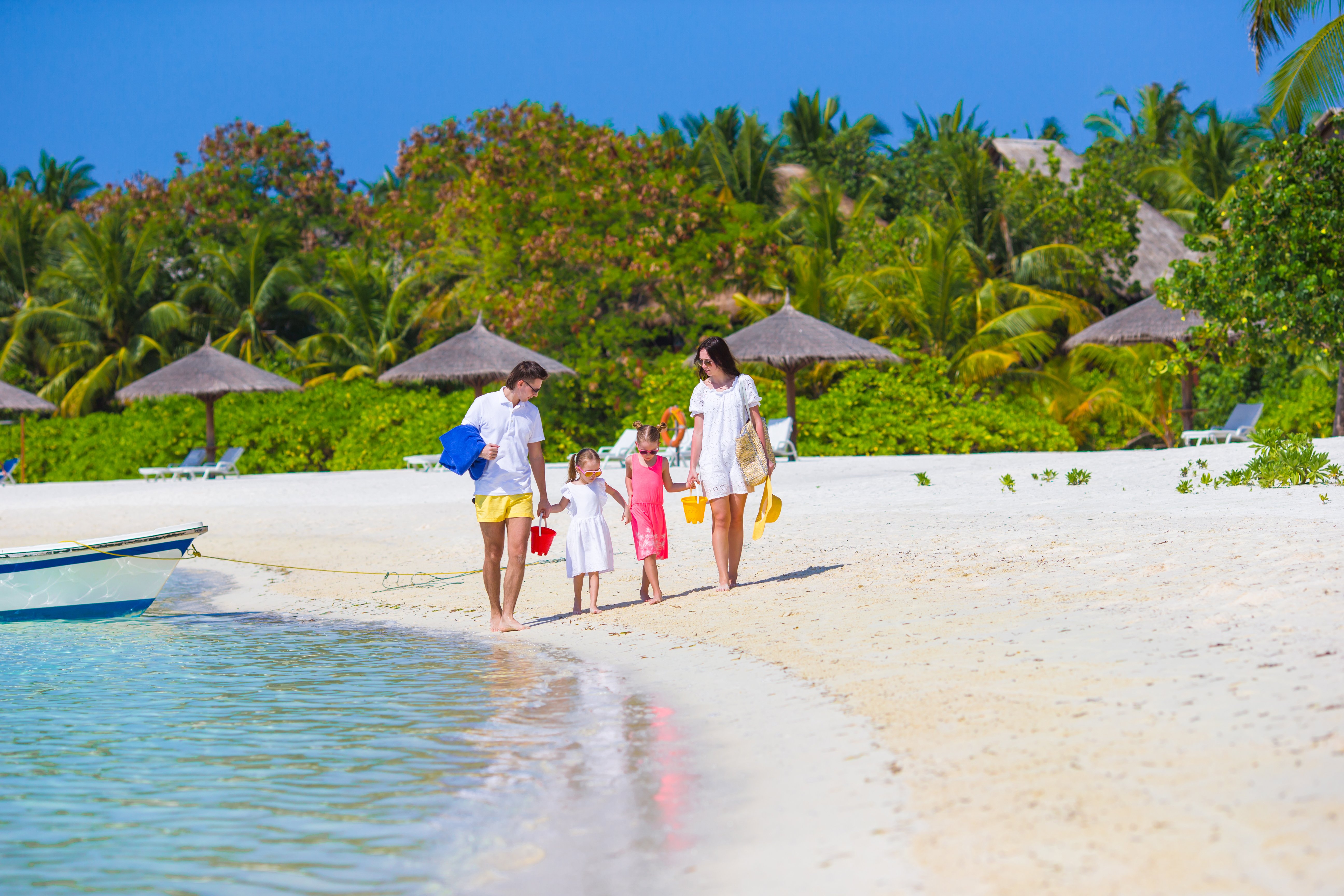 young-family-on-beach-summer-vacation-2022-04-07-19-01-33-utc